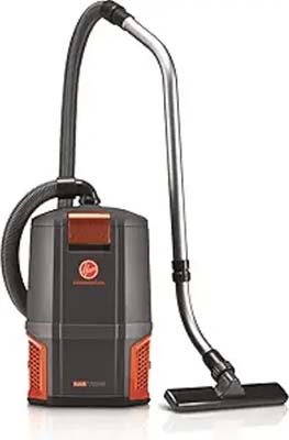 Wet/dry shop vacuum with a flexible hose, metal wand, and wide floor nozzle (black and orange body).