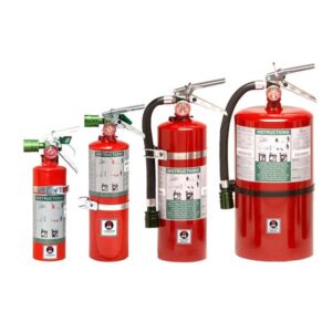 Row of four red fire extinguishers of varying sizes with hoses and instruction labels on a white background.